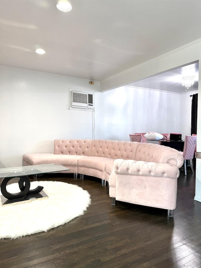 living room with dark hardwood / wood-style flooring and a wall unit AC