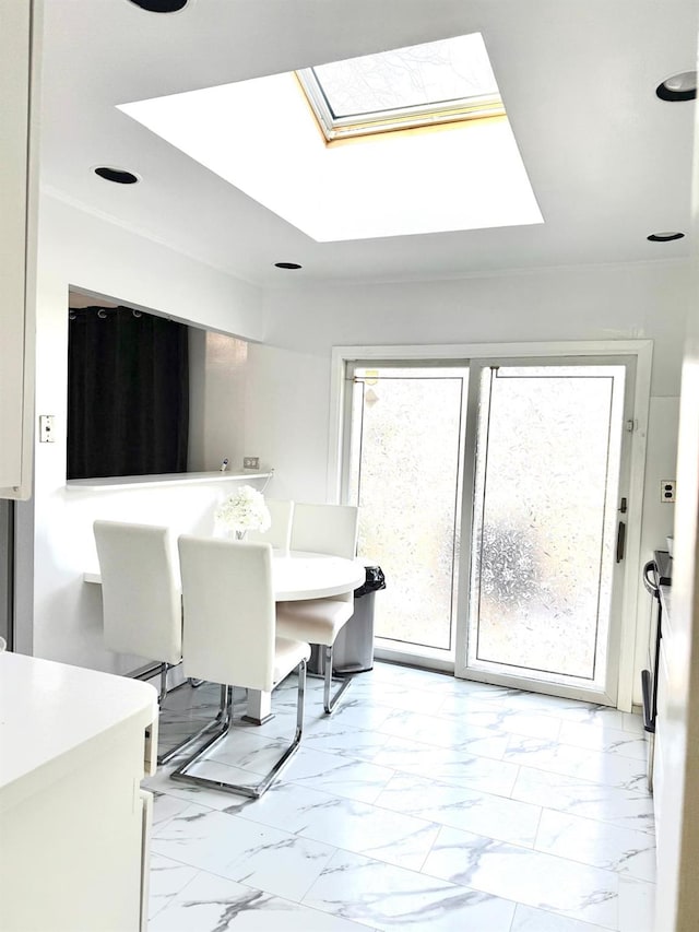 dining area featuring a skylight