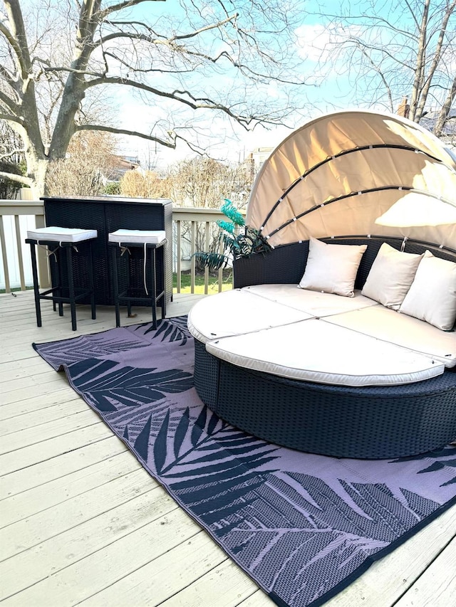 wooden terrace featuring outdoor lounge area