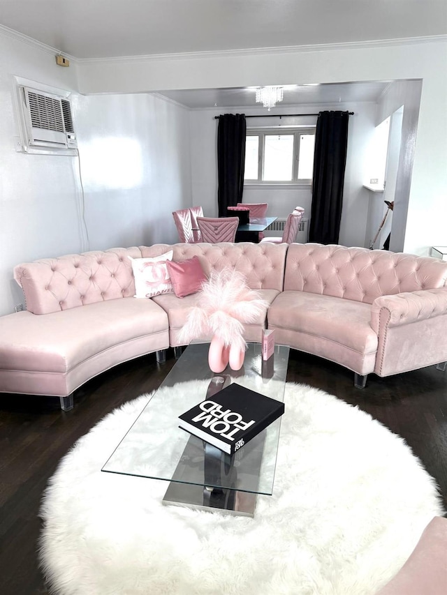 living room featuring crown molding, dark hardwood / wood-style flooring, a chandelier, and an AC wall unit