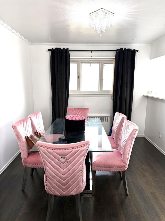 dining room featuring crown molding, dark wood-type flooring, and radiator heating unit