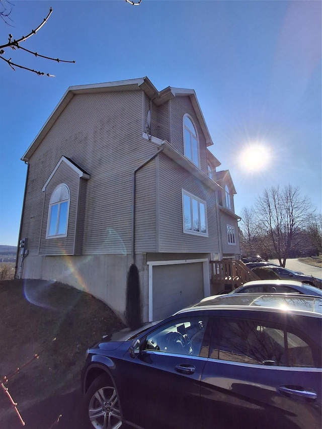 view of side of property featuring a garage