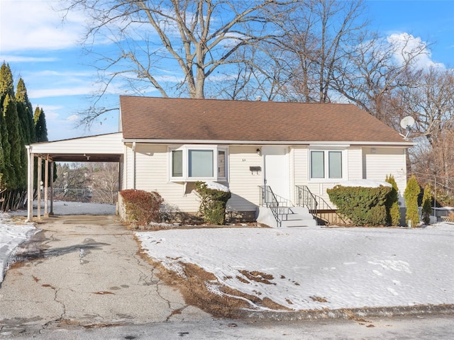 view of front of property with a carport