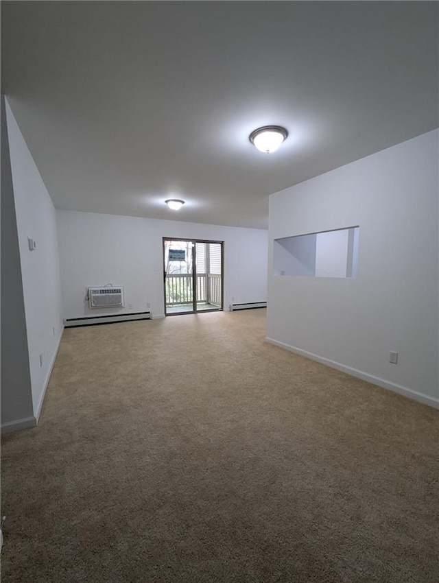 spare room with carpet flooring and a baseboard heating unit