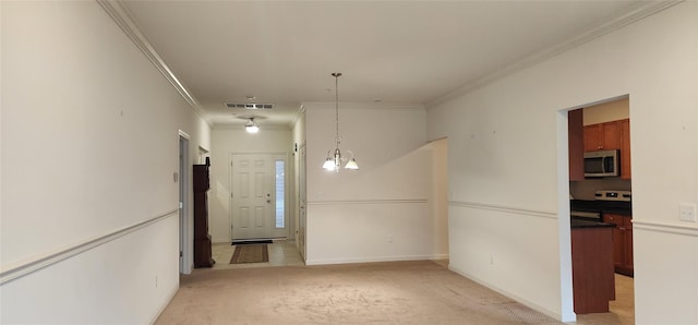 unfurnished dining area with ornamental molding, light carpet, and a chandelier