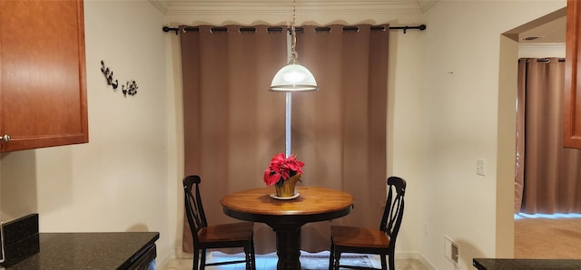 dining area with crown molding