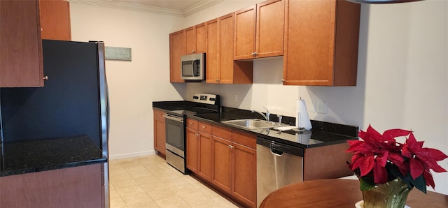 kitchen featuring sink, ornamental molding, and stainless steel appliances