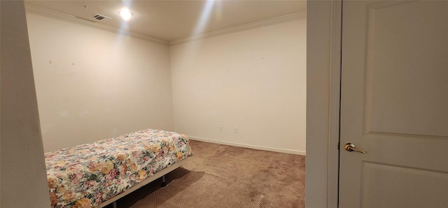 bedroom with light colored carpet and crown molding