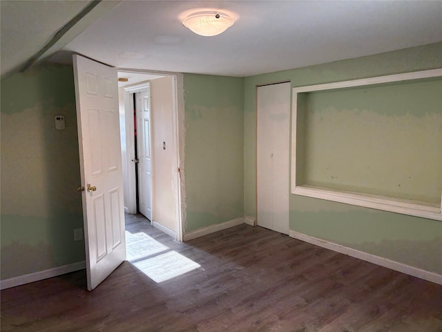 spare room featuring hardwood / wood-style flooring