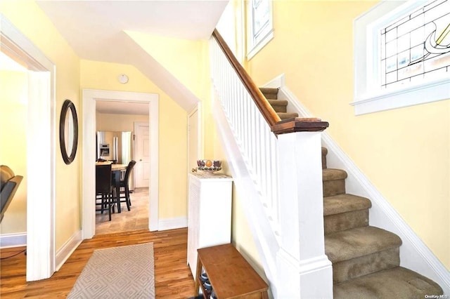 stairway with wood-type flooring