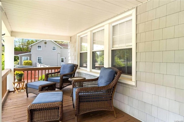 wooden terrace featuring covered porch