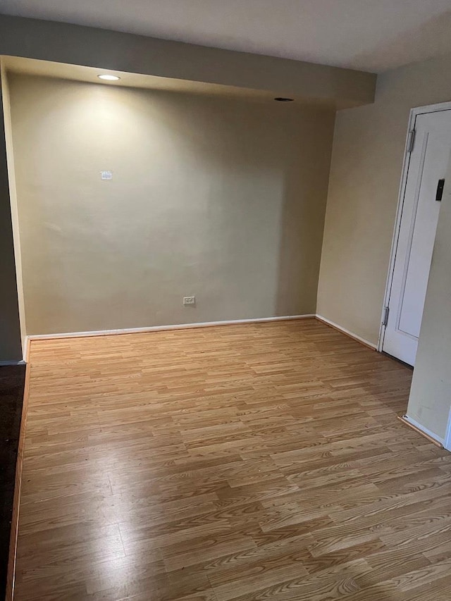 spare room featuring hardwood / wood-style floors