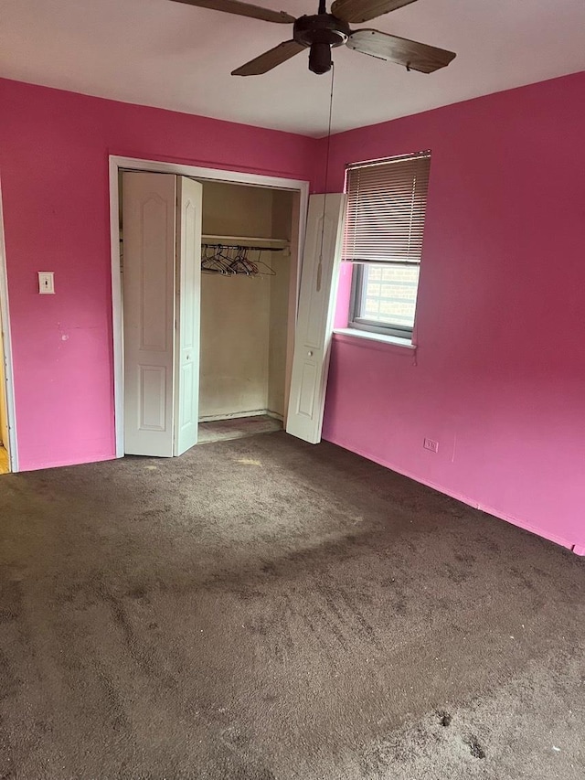 unfurnished bedroom with carpet flooring, ceiling fan, and a closet