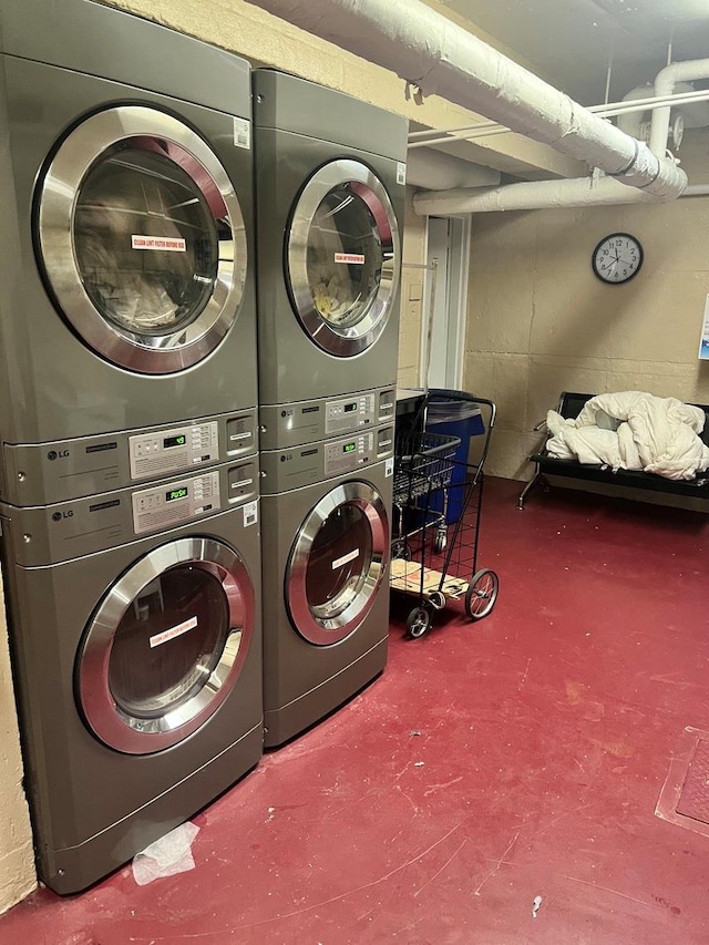 laundry area featuring stacked washer / dryer and washer and dryer