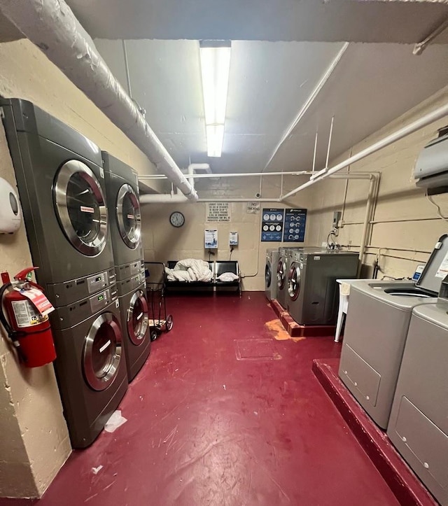 interior space featuring stacked washer and dryer and washing machine and clothes dryer