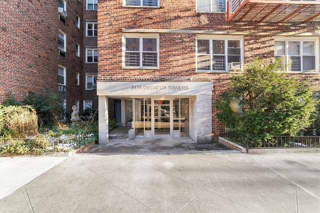 view of exterior entry featuring french doors