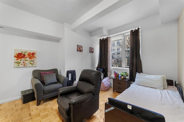 bedroom with light parquet flooring