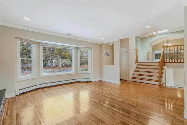 unfurnished living room featuring ornamental molding, light hardwood / wood-style floors, a baseboard heating unit, and an inviting chandelier