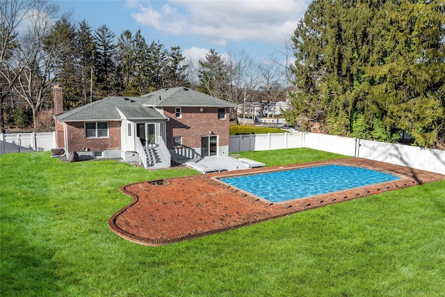 view of pool featuring a patio area and a yard