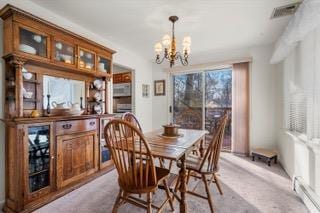 dining space featuring light carpet and a notable chandelier