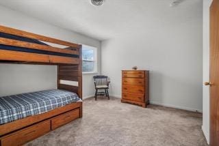 bedroom featuring light colored carpet