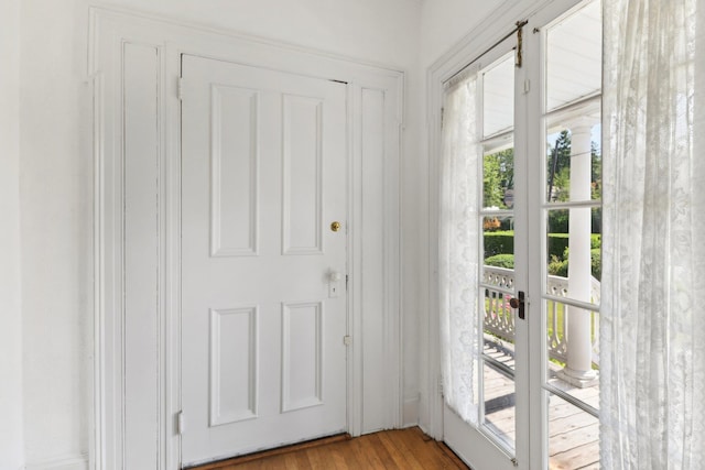 entryway with hardwood / wood-style floors