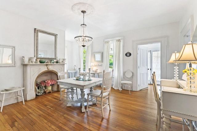 45 Shore Rd, East Setauket, NY 11733 - dining space featuring a chandelier and wood finished floors