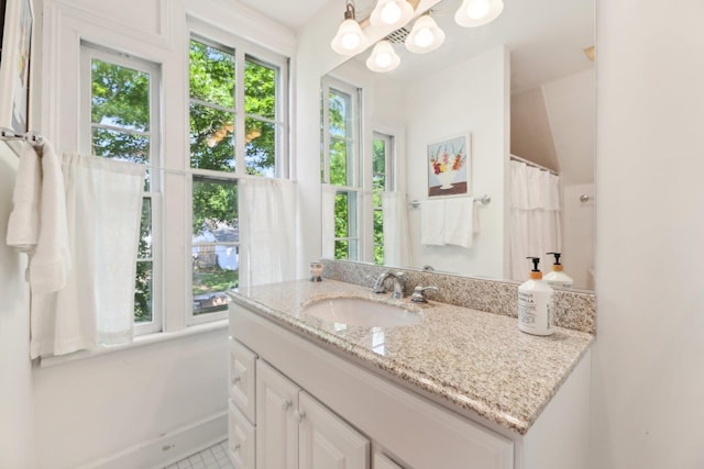 45 Shore Rd, East Setauket, NY 11733 - full bath with vanity, plenty of natural light, and a chandelier