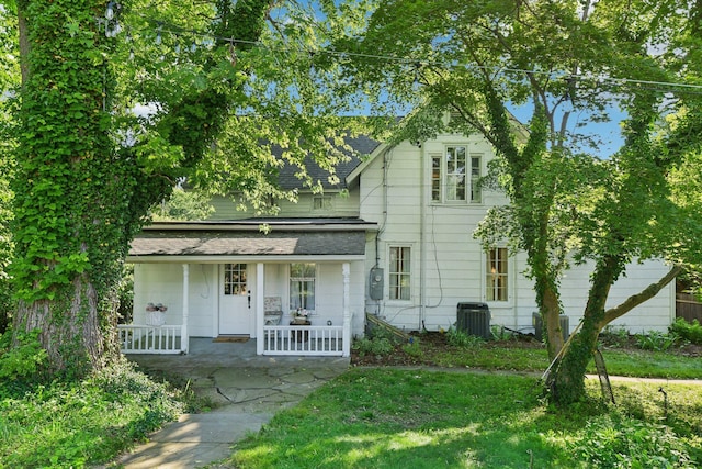 view of front of house featuring a porch and cooling unit