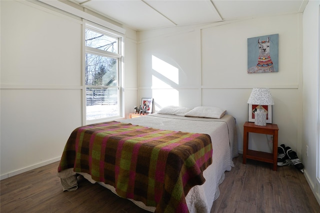 bedroom featuring dark hardwood / wood-style flooring