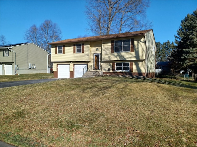 raised ranch featuring a front lawn