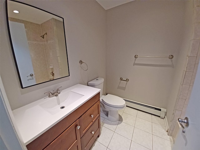 bathroom featuring vanity, tile patterned flooring, toilet, tiled shower, and baseboard heating