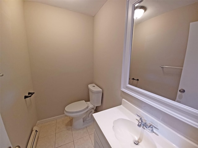 bathroom featuring tile patterned flooring, vanity, toilet, and a baseboard radiator