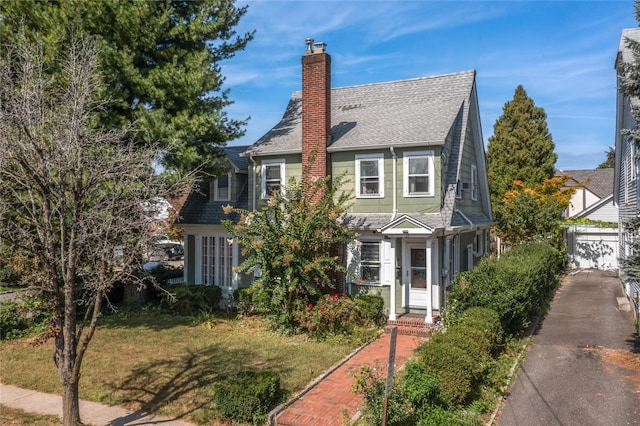 view of front of property with a garage and a front yard