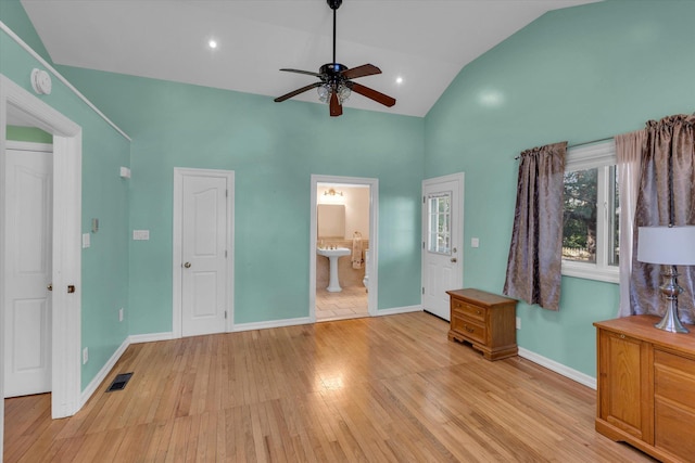 unfurnished bedroom with visible vents, baseboards, light wood-style flooring, high vaulted ceiling, and a ceiling fan