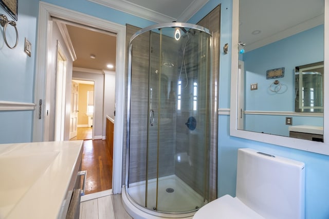 bathroom featuring vanity, crown molding, and walk in shower