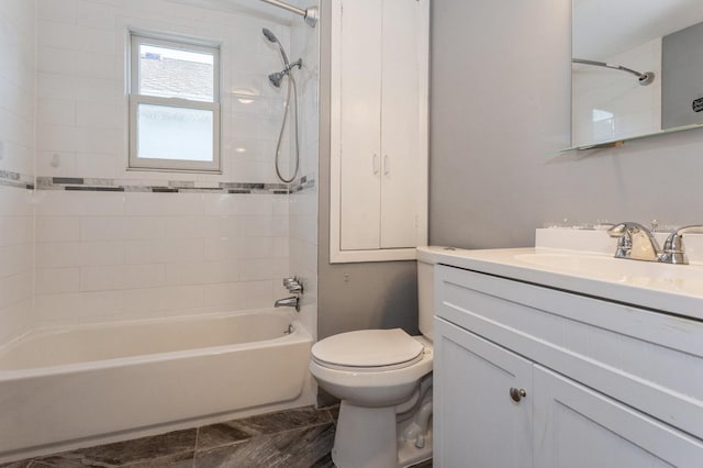 full bathroom with tile patterned flooring, vanity, toilet, and tiled shower / bath combo