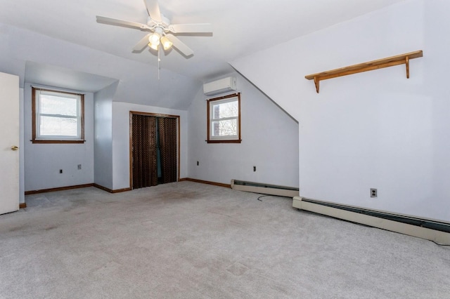 bonus room with light colored carpet, a wall unit AC, ceiling fan, a baseboard heating unit, and lofted ceiling