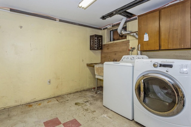 laundry area with cabinets and washer and dryer