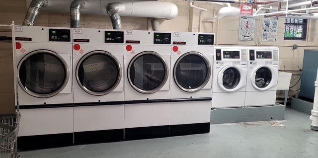 laundry area with washing machine and clothes dryer