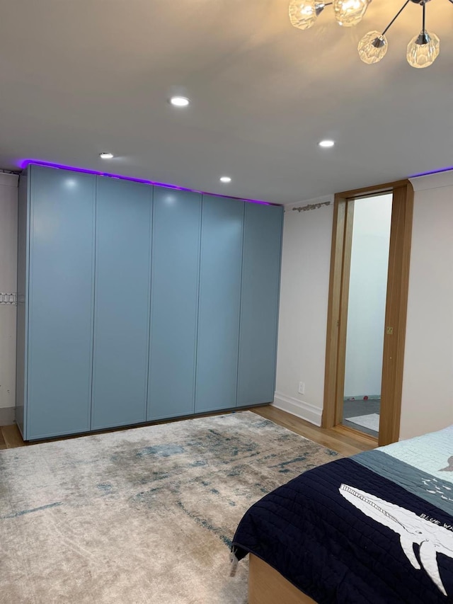 bedroom featuring wood finished floors and recessed lighting