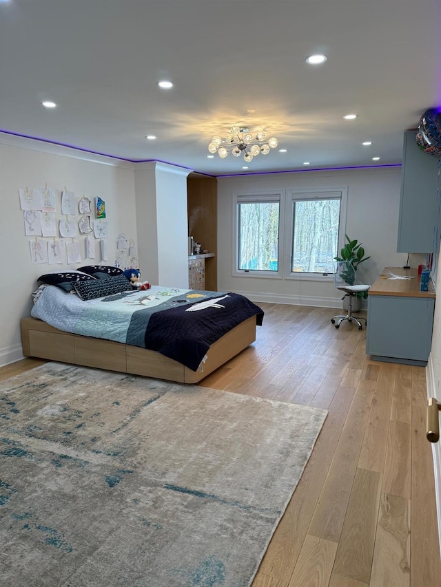 bedroom featuring baseboards, hardwood / wood-style floors, crown molding, and recessed lighting