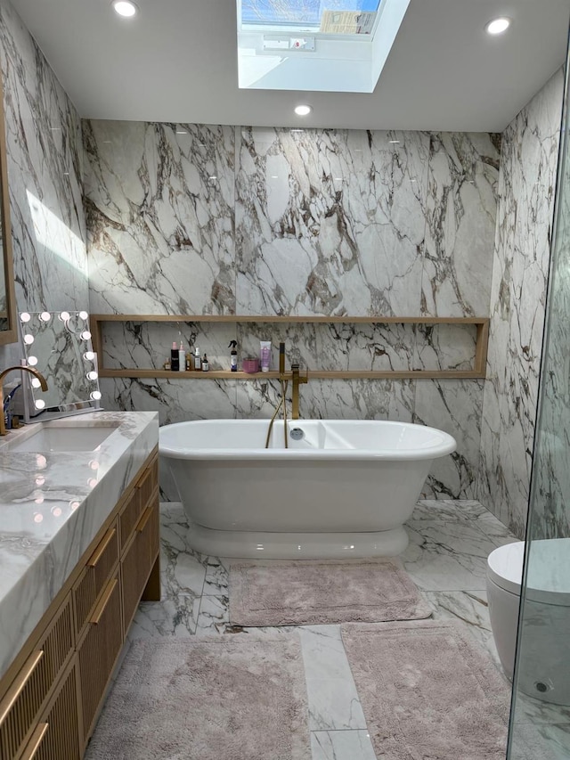 full bathroom featuring recessed lighting and stone wall