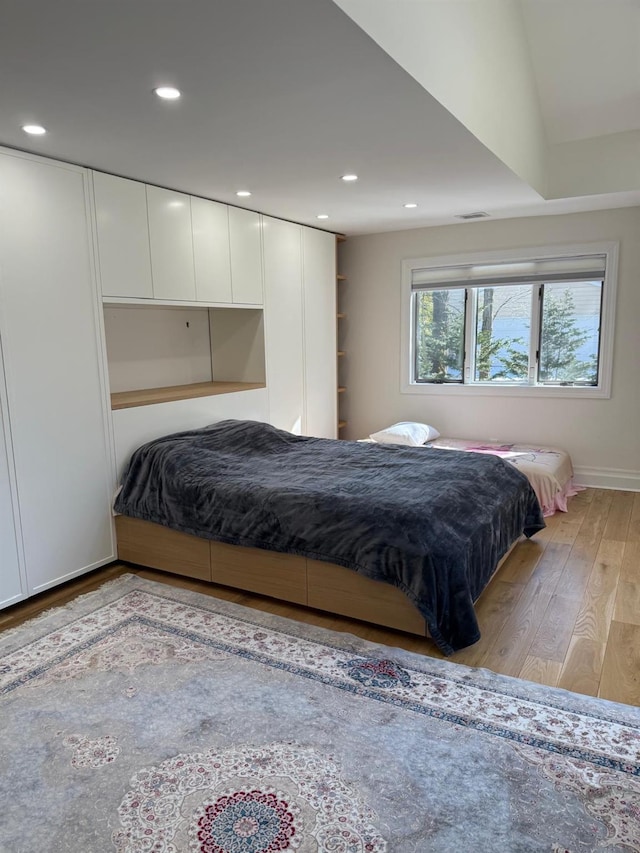 bedroom featuring light wood-style floors and recessed lighting