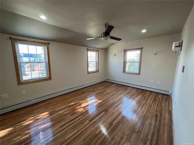 unfurnished room with wood-type flooring, lofted ceiling, ceiling fan, and a baseboard heating unit