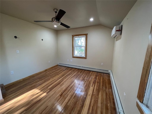 unfurnished room with a wall mounted AC, ceiling fan, a baseboard radiator, hardwood / wood-style floors, and lofted ceiling