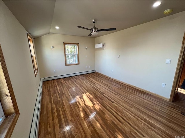 unfurnished bedroom with hardwood / wood-style flooring, vaulted ceiling, a wall mounted AC, and a baseboard heating unit