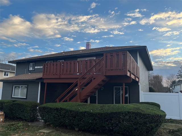 back of property featuring a deck