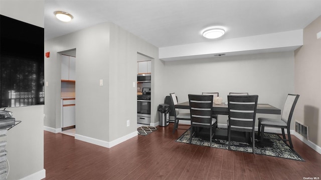 dining area featuring dark hardwood / wood-style floors