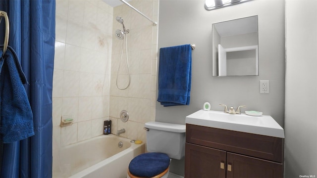 full bathroom with vanity, toilet, and shower / tub combo with curtain